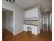 Office space with built-in cabinets, granite countertops, and hardwood floors at 255 Henson Way, Canton, GA 30115