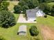 A rear aerial view of the property, highlighting the large lot, shed, and driveway at 255 Henson Way, Canton, GA 30115