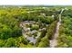 Overhead view of a neighborhood surrounded by mature trees and greenery, showcasing its natural beauty at 1140 Moorestown Cir, Decatur, GA 30033