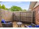 A secluded backyard has a private patio with lounge chairs and a privacy fence at 1140 Moorestown Cir, Decatur, GA 30033