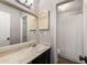 Traditional bathroom with a large mirror, single sink, decorative cabinet, and shower and tub combination at 1140 Moorestown Cir, Decatur, GA 30033
