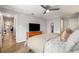 This bedroom features hardwood floors, a ceiling fan, and a double door closet at 1140 Moorestown Cir, Decatur, GA 30033