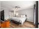 Comfortable bedroom with hardwood floors, soft lighting, and closet space at 1140 Moorestown Cir, Decatur, GA 30033