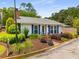 Charming single-story home with blue shutters, a brick chimney, and a well-maintained landscaped front yard at 1140 Moorestown Cir, Decatur, GA 30033