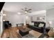 Bright living room with hardwood floors, comfortable seating, and a modern ceiling fan at 1140 Moorestown Cir, Decatur, GA 30033