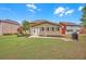 Wide backyard featuring a well-maintained lawn and covered porch at 1990 Cooper Lakes Dr, Grayson, GA 30017