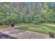 Backyard patio backing onto a wooded area. A peaceful space at 1990 Cooper Lakes Dr, Grayson, GA 30017