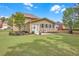 Spacious backyard featuring well-kept lawn and a comfortable patio area at 1990 Cooper Lakes Dr, Grayson, GA 30017