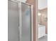 Bathroom showing frosted glass shower door and vanity with marble countertop at 1990 Cooper Lakes Dr, Grayson, GA 30017