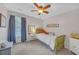Bedroom with a modern ceiling fan and a sunlit window view at 1990 Cooper Lakes Dr, Grayson, GA 30017