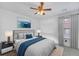 Beautiful bedroom with a gray accent wall, soft carpet, and a ceiling fan at 1990 Cooper Lakes Dr, Grayson, GA 30017