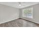 Neutral bedroom with hardwood floors and a bright window view at 1990 Cooper Lakes Dr, Grayson, GA 30017