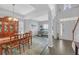 Inviting dining area featuring high ceilings, hardwood floors, and an adjacent study area at 1990 Cooper Lakes Dr, Grayson, GA 30017