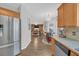 Spacious kitchen offering stainless steel appliances with an open view to the cozy living area at 1990 Cooper Lakes Dr, Grayson, GA 30017