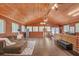 Spacious living room with wood ceilings and walls, offering a rustic and inviting atmosphere at 1990 Cooper Lakes Dr, Grayson, GA 30017