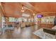 Open living room features wood accents, a seating area, and multiple large windows at 1990 Cooper Lakes Dr, Grayson, GA 30017