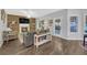 Inviting living room features wood accent wall, fireplace, and plenty of natural light at 1990 Cooper Lakes Dr, Grayson, GA 30017