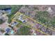 An aerial view outlining the property lines of a home with pond access, nestled among lush trees at 2885 Green Rd, Loganville, GA 30052