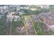 An aerial view outlining the property lines of a home nestled amongst towering trees, with a view of surrounding homes at 2885 Green Rd, Loganville, GA 30052