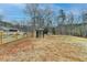 Expansive fenced backyard with potential for various activities and access to surrounding wooded areas at 2885 Green Rd, Loganville, GA 30052
