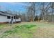 Expansive backyard with a custom fire pit and partial fence for privacy at 2885 Green Rd, Loganville, GA 30052