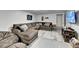 Finished basement featuring a sectional couch, a mounted TV, neutral paint and decor, and carpeted floors at 2885 Green Rd, Loganville, GA 30052
