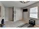 Neutral bedroom with a double closet, large window offering natural light and a TV mounted on the wall at 2885 Green Rd, Loganville, GA 30052
