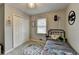 Cozy bedroom features carpet and a double door closet at 2885 Green Rd, Loganville, GA 30052