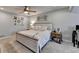 Comfortable bedroom with a ceiling fan, complemented by neutral tones, decor, and soft carpet at 2885 Green Rd, Loganville, GA 30052