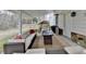 Inviting covered patio with comfortable seating and a heater and outdoor grill at 2885 Green Rd, Loganville, GA 30052