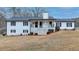 Inviting view of a well-maintained home with a welcoming front porch and manicured landscaping at 2885 Green Rd, Loganville, GA 30052