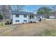 Spacious two-story home with a covered carport, featuring a well-kept lawn and inviting front porch at 2885 Green Rd, Loganville, GA 30052