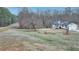 Aerial view of a large front yard featuring a white two-story home and mature trees at 2885 Green Rd, Loganville, GA 30052