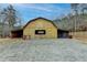 Exterior view of a horse barn featuring an overhang and multiple entrances at 2885 Green Rd, Loganville, GA 30052