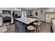 Modern kitchen island with seating and stainless steel appliances at 2885 Green Rd, Loganville, GA 30052