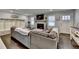 Living room showcasing a stone fireplace and a large sectional sofa at 2885 Green Rd, Loganville, GA 30052