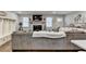 Comfortable living room featuring a stone fireplace and built-in storage at 2885 Green Rd, Loganville, GA 30052