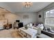 Combination bedroom/living space featuring a seating area, desk, and white accents with lots of natural light at 2885 Green Rd, Loganville, GA 30052