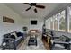 Charming screened porch featuring ceiling fan, porch swing, and comfortable wicker seating at 2885 Green Rd, Loganville, GA 30052