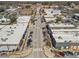 Aerial perspective of a town's main street, displaying a variety of commercial buildings and parking at 4178 Castle Pines Ct, Tucker, GA 30084