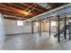 Unfinished basement with concrete floor, exposed ceiling and support beams at 4178 Castle Pines Ct, Tucker, GA 30084