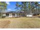 Charming single-story home featuring a well-maintained lawn and a classic brick facade, perfect for suburban living at 4178 Castle Pines Ct, Tucker, GA 30084