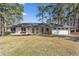 Beautiful single-story home with classic brick facade, manicured front yard, and attached garage for comfortable suburban living at 4178 Castle Pines Ct, Tucker, GA 30084