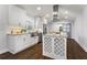 Modern kitchen island with granite countertops and stainless-steel appliances at 4178 Castle Pines Ct, Tucker, GA 30084