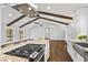 Spacious kitchen with granite countertops, stainless steel appliances, and an island cooktop at 4178 Castle Pines Ct, Tucker, GA 30084