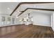 Open floor plan with hardwood floors connecting to a stylish white kitchen at 4178 Castle Pines Ct, Tucker, GA 30084