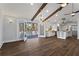Living room area with vaulted ceiling and hardwood floors leads to the patio at 4178 Castle Pines Ct, Tucker, GA 30084