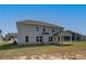 View of home's backyard, showing the ample space and covered patio area at 612 Sidney Ct, Stockbridge, GA 30281