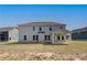 Backyard of home with a covered patio and ample green space at 612 Sidney Ct, Stockbridge, GA 30281