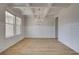 Elegant dining room features a coffered ceiling, chandelier, and ample natural light at 612 Sidney Ct, Stockbridge, GA 30281